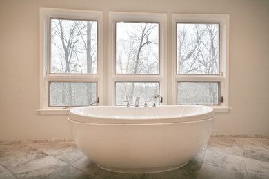 Large elegant master gray tile and ceramic tile ceramic tile and gray floor bathroom photo in Philadelphia with recessed-panel cabinets, dark wood cabinets, an undermount sink, granite countertops and a hinged shower door
