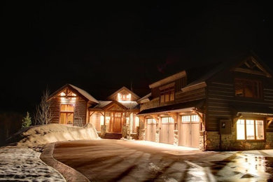 Inspiration for a large rustic multicolored two-story mixed siding exterior home remodel in Denver with a shingle roof