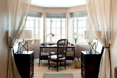 Inspiration for a small timeless freestanding desk light wood floor and beige floor study room remodel in Boston with beige walls