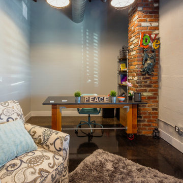 Industrial-Inspired Home Office with Personalized Décor and Creative Touches