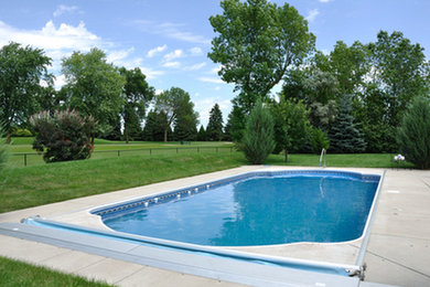 Pool - mid-sized backyard concrete paver and rectangular lap pool idea in Other