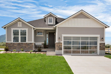 Inspiration for a gray mixed siding house exterior remodel in Salt Lake City with a shingle roof