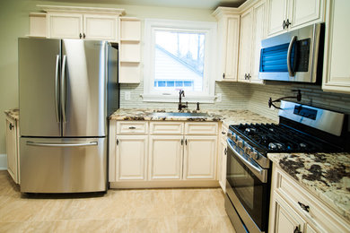 Example of a mid-sized kitchen design in New York