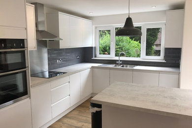 Inspiration for a large contemporary kitchen in Surrey.