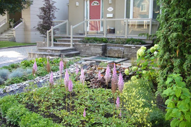 Mid-sized elegant stone porch photo in Toronto