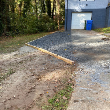 Slate rock driveway and slate rock walkway to the basement.