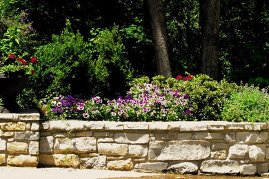 Design ideas for a small traditional full sun hillside stone landscaping in Other.