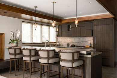 Example of a mid-sized minimalist u-shaped limestone floor kitchen design in San Diego with an undermount sink, flat-panel cabinets, dark wood cabinets, marble countertops, gray backsplash, marble backsplash, paneled appliances, a peninsula and gray countertops