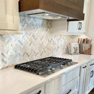 Cherry Finish and Ivory Painted Kitchen Design With Herringbone Wall Tile