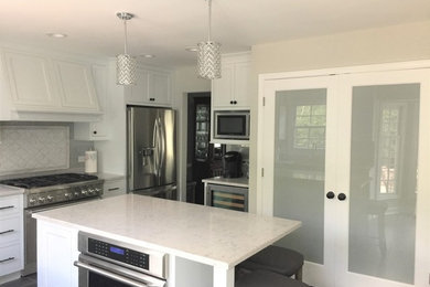 Large l-shaped gray floor eat-in kitchen photo in Chicago with beaded inset cabinets, white cabinets, granite countertops, gray backsplash, subway tile backsplash, stainless steel appliances, an island and white countertops