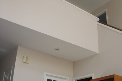 Hallway - mid-sized transitional hallway idea in Grand Rapids with beige walls