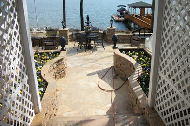 This is an example of a large full sun backyard landscaping in Charlotte.