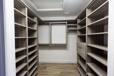 Closet - mid-sized contemporary closet idea in Other