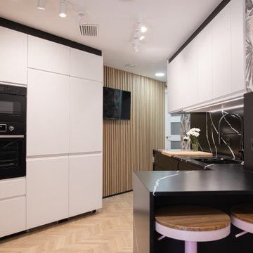 Cocina semioculta con barra informal