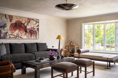 Minimalist enclosed medium tone wood floor living room photo in New York with beige walls and a wood fireplace surround