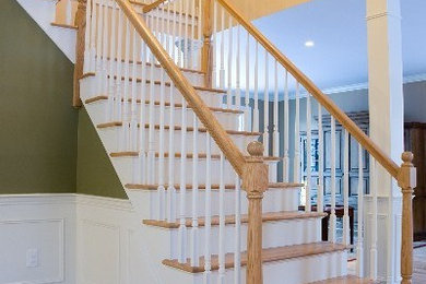 Example of a mid-sized classic wooden l-shaped staircase design in Bridgeport with painted risers