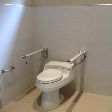 Comfort Height Toilet with Fold Down Grab Bars