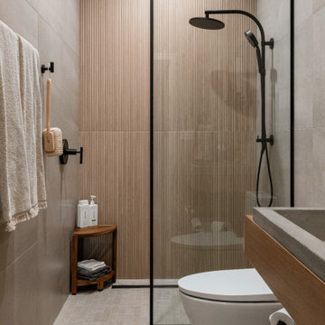 Warm Modern Wet Room Bathroom with Floating Wood Vanity & Open Storage