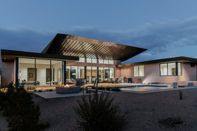 Minimalist beige one-story metal house exterior photo in Phoenix with a shed roof, a metal roof and a brown roof