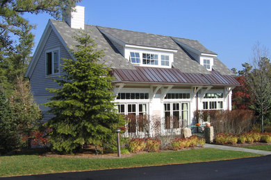 Inspiration for a small timeless gray two-story mixed siding gable roof remodel in Boston