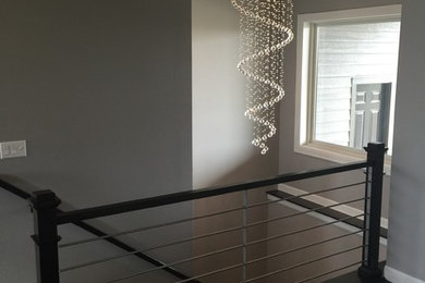 Staircase - contemporary staircase idea in Other