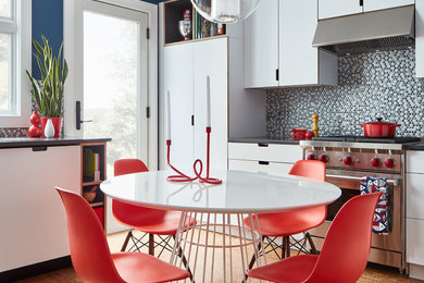 Eat-in kitchen - mid-sized contemporary cork floor and brown floor eat-in kitchen idea in Other with an undermount sink, flat-panel cabinets, white cabinets, quartz countertops, gray backsplash, ceramic backsplash, stainless steel appliances and no island
