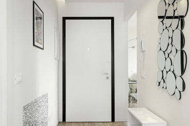 Esempio di un corridoio contemporaneo di medie dimensioni con pareti bianche, pavimento in gres porcellanato, una porta singola, una porta bianca, pavimento marrone, soffitto ribassato e pannellatura