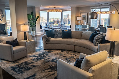 Living room - contemporary dark wood floor and brown floor living room idea in Kansas City with gray walls and a wall-mounted tv