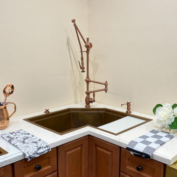 Corner sinks and corner sink kitchens