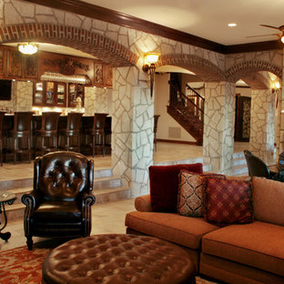 Classic walk-out basement in Kansas City with limestone flooring, a standard fireplace and a stone fireplace surround.