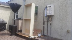 tankless gas water heater in cabinet