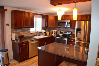 Eat-in kitchen - mid-sized modern l-shaped light wood floor eat-in kitchen idea in New York with a double-bowl sink, recessed-panel cabinets, red cabinets, laminate countertops, metallic backsplash, glass tile backsplash, stainless steel appliances and a peninsula