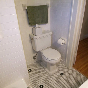Hexago tile floor with white subway tile walls