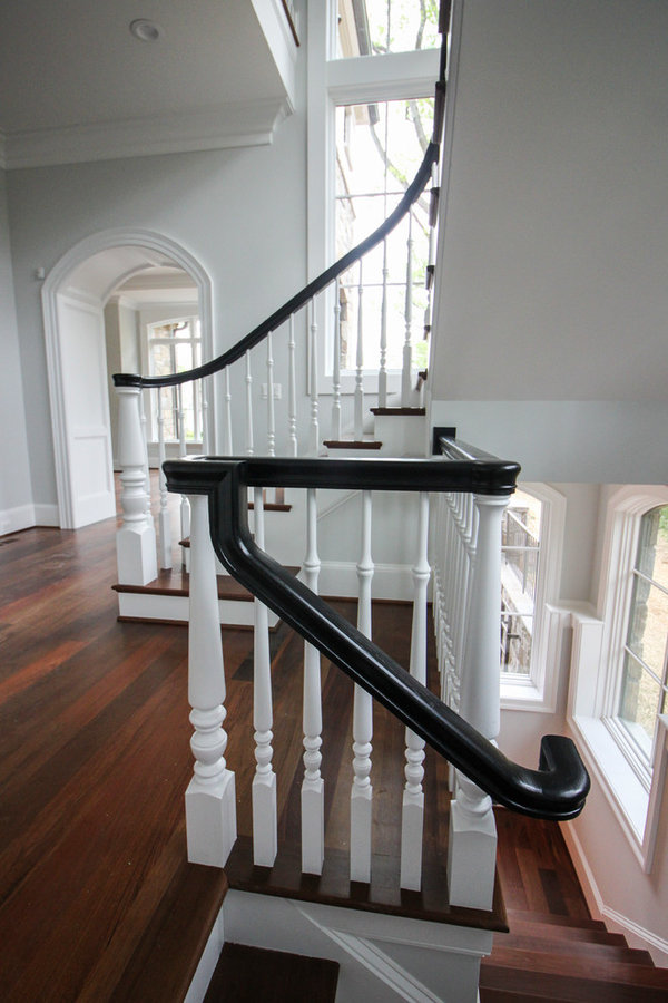 Powerful Impression by Floating Staircase in Suburban Foyer