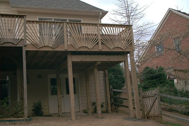 Example of a large mountain style backyard deck design in Atlanta with no cover