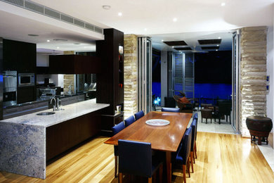 Inspiration for a light wood floor great room remodel in Hawaii with white walls and no fireplace