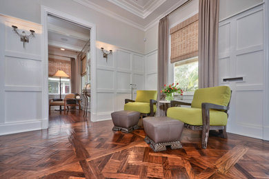 Inspiration for a large transitional medium tone wood floor hallway remodel in Tampa with gray walls