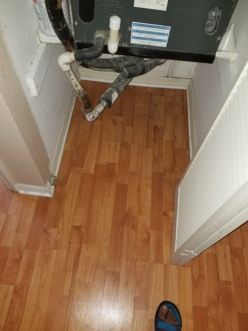 Gray Laminate Floor In Kitchen With Brown Cabinets