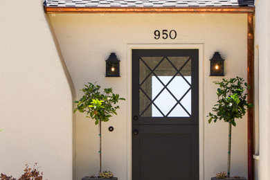 Mid-sized trendy white two-story stucco gable roof photo in Santa Barbara