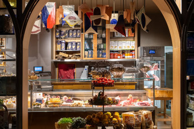 Idee per una taverna bohémian di medie dimensioni con pareti marroni, pavimento con piastrelle in ceramica e pavimento beige