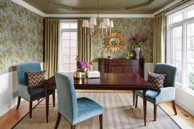 Mid-sized transitional medium tone wood floor and brown floor enclosed dining room photo in Chicago with green walls and no fireplace
