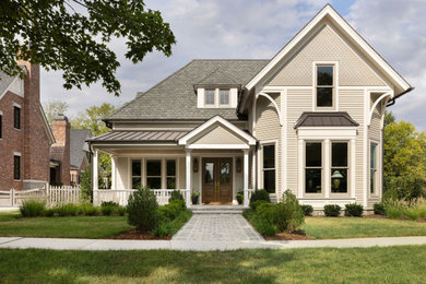 Transitional beige two-story clapboard exterior home idea in Nashville with a shingle roof and a gray roof