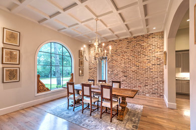 Dining room - traditional light wood floor dining room idea in Houston with beige walls