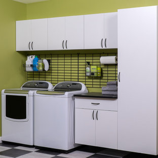 This is an example of a medium sized traditional u-shaped utility room in Boston with white cabinets, composite countertops, green walls, ceramic flooring, a side by side washer and dryer and flat-panel cabinets.