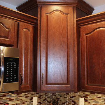 Kitchen Design: StarMark Cabinetry in Oak Royale, HD Formica Countertop