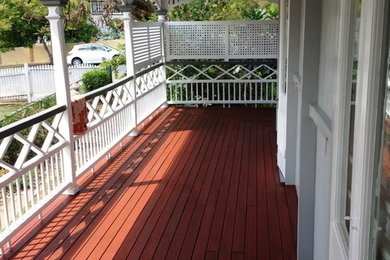 This is an example of a mid-sized country balcony in Brisbane with a roof extension.