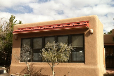 Inspiration for a southwestern brown stucco exterior home remodel in Other
