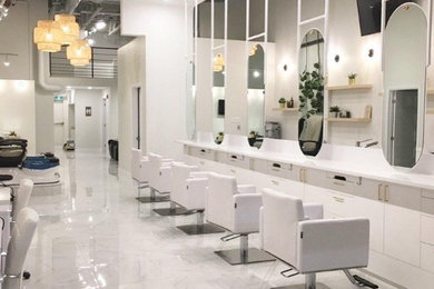 Inspiration for a large modern porcelain tile and white floor hallway remodel in Montreal