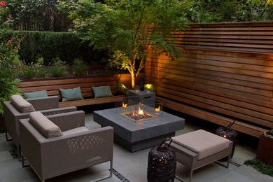 Mid-sized trendy backyard tile patio photo in Miami with a fire pit and no cover