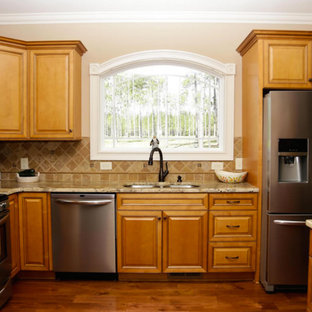 Large traditional kitchen pantry designs - Large elegant medium tone wood floor kitchen pantry photo in Raleigh with medium tone wood cabinets, stainless steel appliances, a double-bowl sink and recessed-panel cabinets